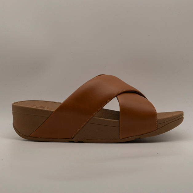 FitFlop Lulu Cross Slides – sandalo in pelle con fasce incrociate e zeppa - cuoio - scarpe di qualità venduta a Milano da Pli-Pla