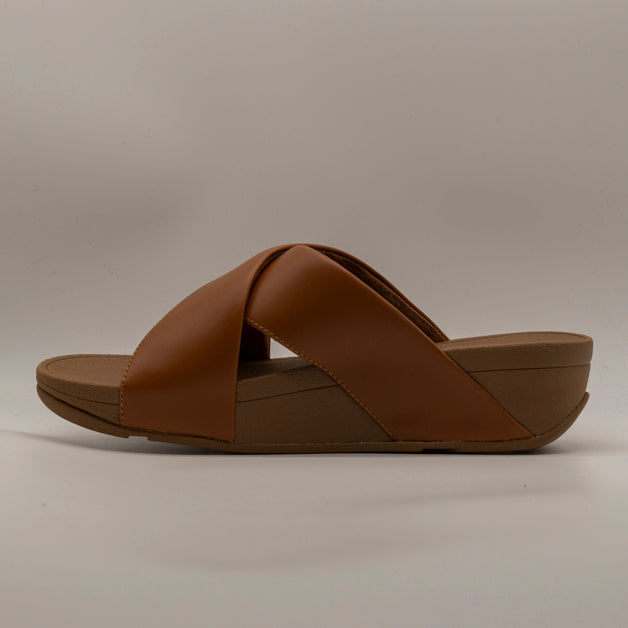 FitFlop Lulu Cross Slides – sandalo in pelle con fasce incrociate e zeppa - cuoio - scarpe di qualità venduta a Milano da Pli-Pla