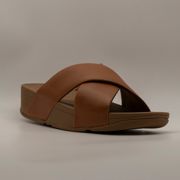 FitFlop Lulu Cross Slides – sandalo in pelle con fasce incrociate e zeppa - cuoio - scarpe di qualità venduta a Milano da Pli-Pla
